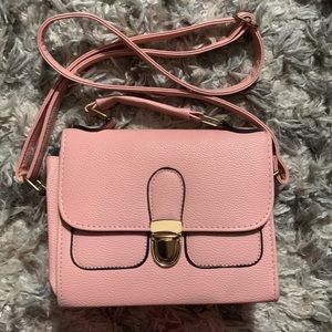 Pink purse with cross body strap